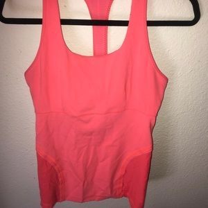 Lululemon razor back tank, coral/pink in color